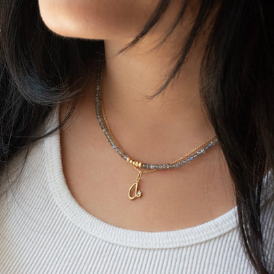 Anne Sportun 18k yellow gold hammered beads on a faceted necklace.