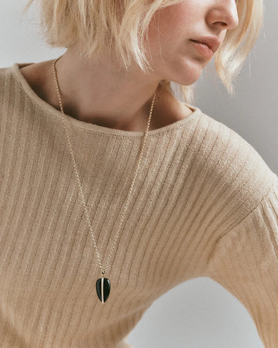 By Pariah black onyx pendant wrapped in 14k yellow gold with white diamonds