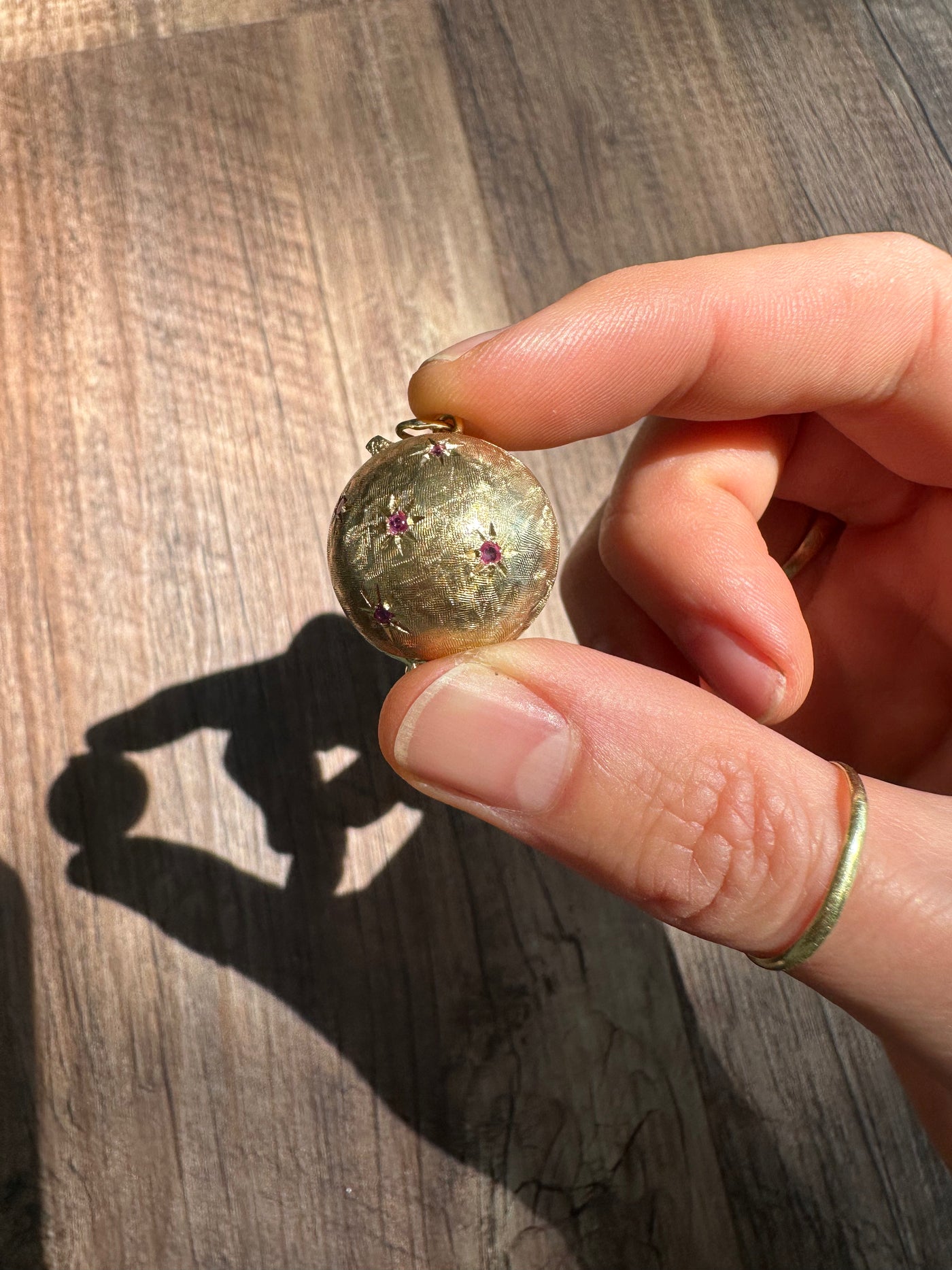 Estate & Vintage 14k yellow gold hollow gemstone orb locket with sapphire rubies 1950s unique keepsake. Can hold 3-6 photos (double-sided).
