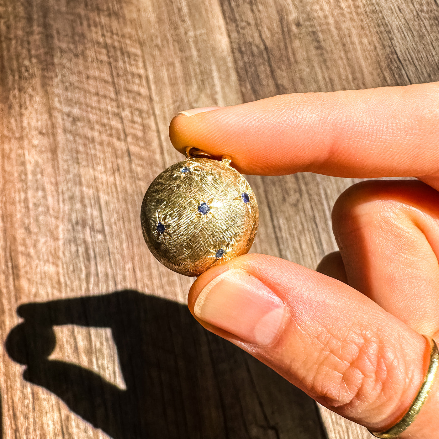 Estate & Vintage 14k yellow gold hollow gemstone orb locket with sapphire rubies 1950s unique keepsake. Can hold 3-6 photos (double-sided).