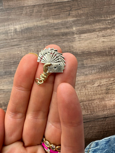 Estate & Vintage 14k yellow and white gold charm, hand holding a set of playing cards adorned with red and black enamel. Vegas, poker, Texas hold 'em, Black Jack
