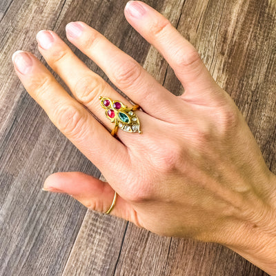 Estate & Vintage yellow gold intricate ring with rose cut diamonds, marquise emerald, and cabochon rubies