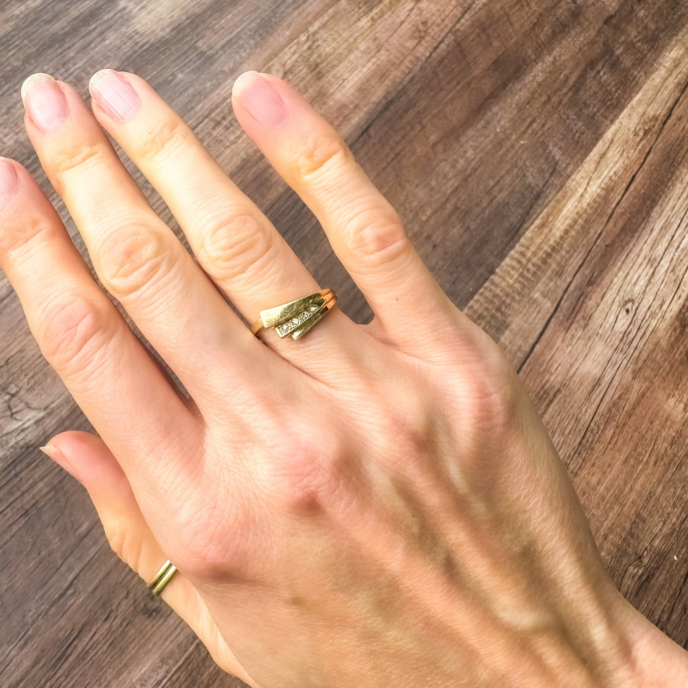 Vintage and estate collection 14k yellow gold swoop ring with four white diamonds