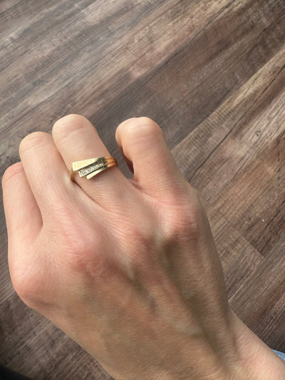 Vintage and estate collection 14k yellow gold swoop ring with four white diamonds