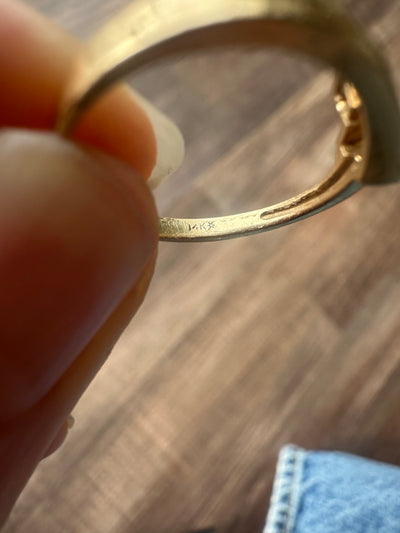 Vintage and estate collection 14k yellow gold swoop ring with four white diamonds