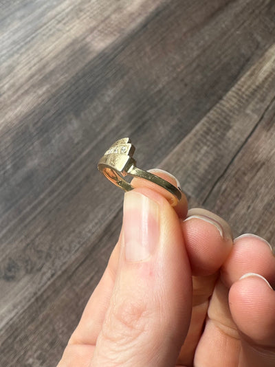Vintage and estate collection 14k yellow gold swoop ring with four white diamonds