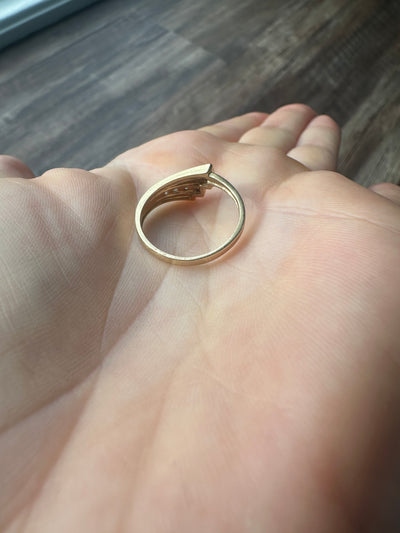 Vintage and estate collection 14k yellow gold swoop ring with four white diamonds