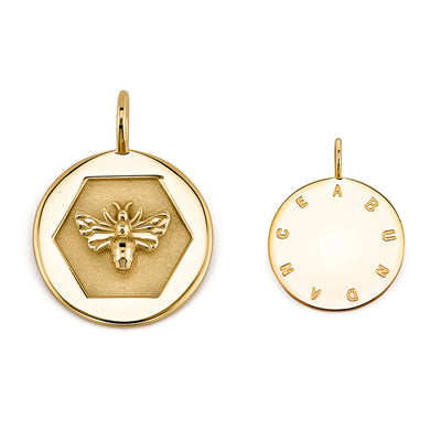 Kate Collins 14k yellow gold round disc charm pendant with a bee signifying abundance and empowerment.