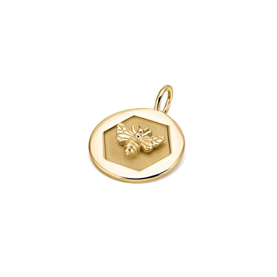 Kate Collins 14k yellow gold round disc charm pendant with a bee signifying abundance and empowerment.