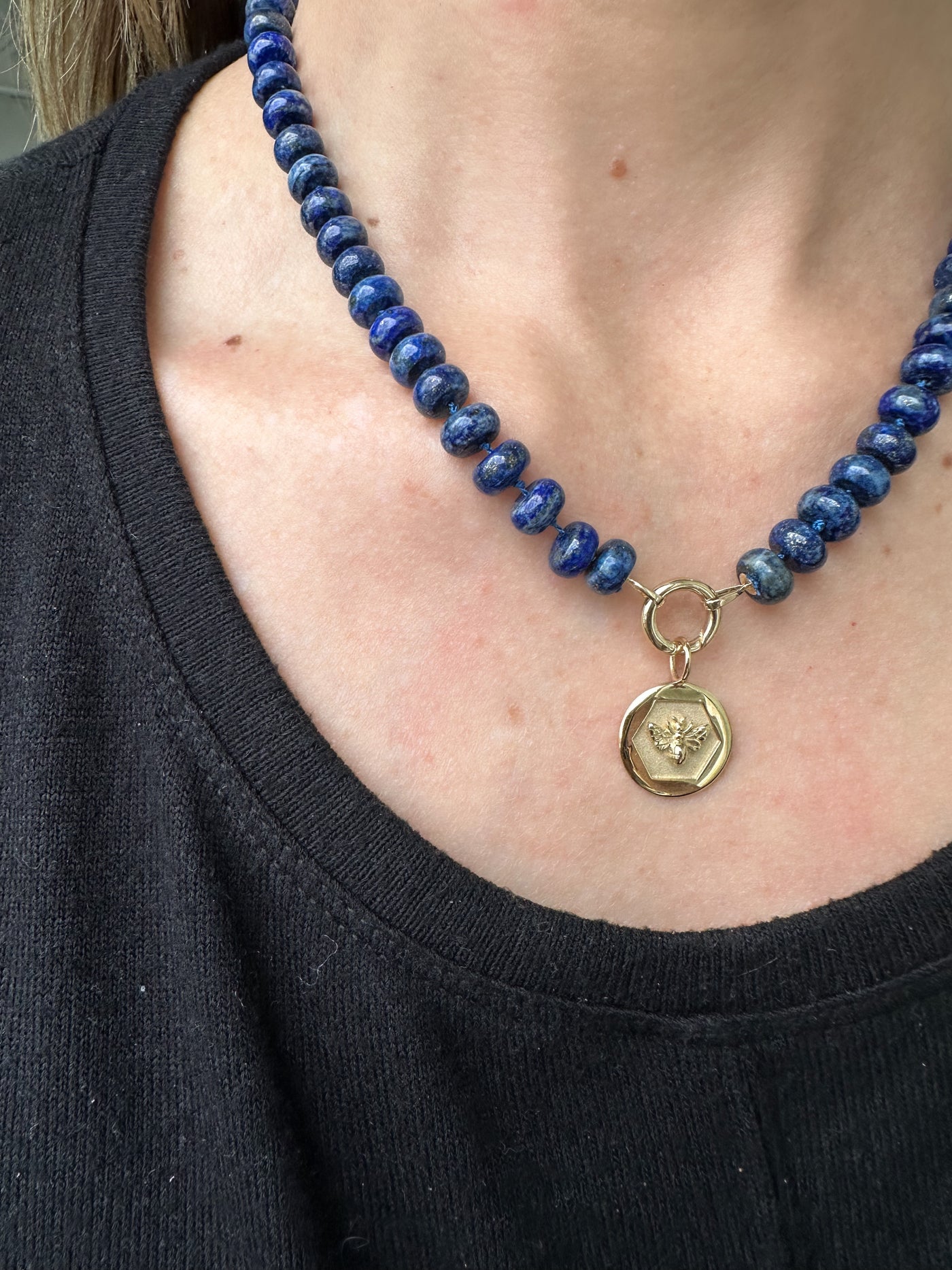 Kate Collins 16" lapis beads strung on knotted blue silk necklace with 14k gold hinge clasp
