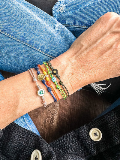 Luis Morais enamel evil eye 14k gold disk on a silk cord bracelet