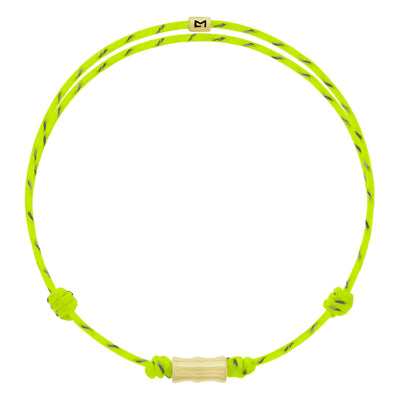 Luis Morais 14k yellow gold bamboo bead spacer on a neon green adjustable cord bracelet