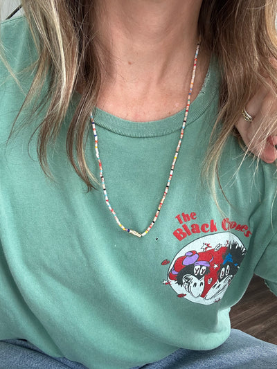 Luis Morais 14k yellow gold sheath bead with evil eye on a picasso jasper and rainbow glass bead necklace