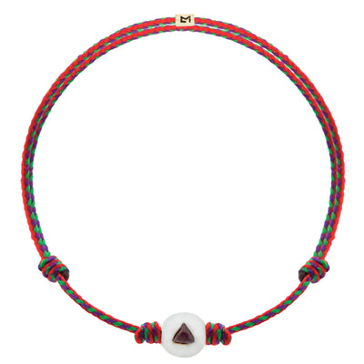 Luis Morais 14k Yellow gold medium sized ball with white enamel & a trillion cut ruby on an adjustable silk cord bracelet