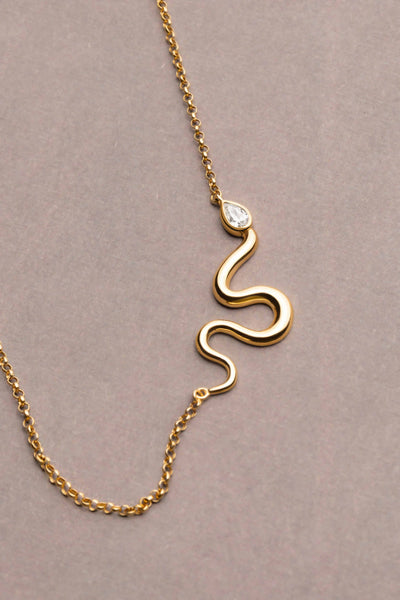 L'Atelier Nawbar 18k yellow gold chain with a snake that has a white diamond serpent head