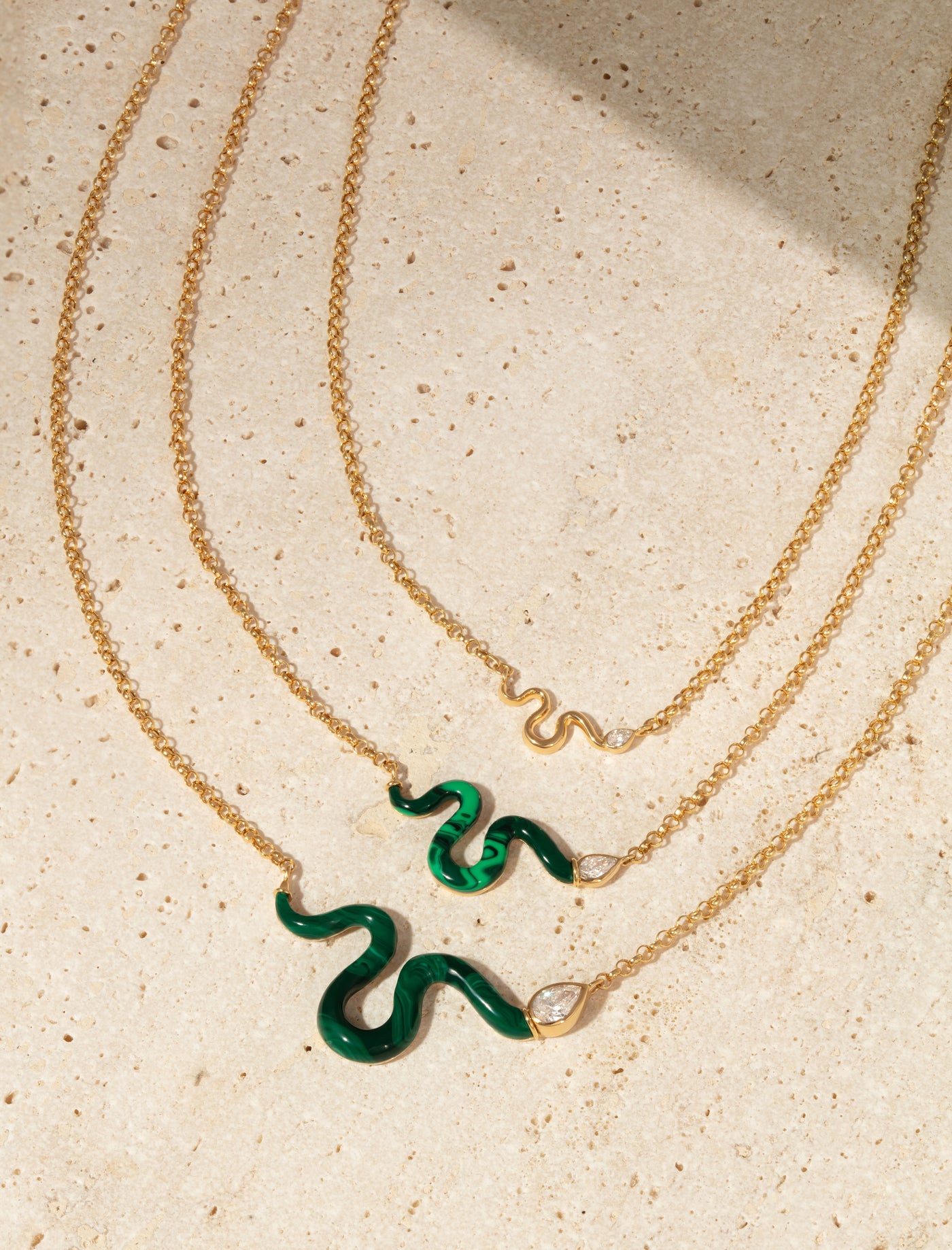 L'Atelier Nawbar 18k yellow gold chain with a snake that has a white diamond serpent head