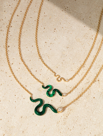 L'Atelier Nawbar 18k yellow gold chain with a snake that has a white diamond serpent head