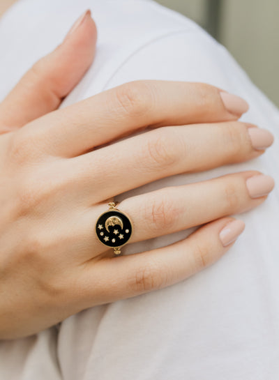 L'Atelier Nawbar 18k yellow gold 3-in-1 Day and Night ring with black onyx, mother of pearl, and white diamonds. Can also be a pendant