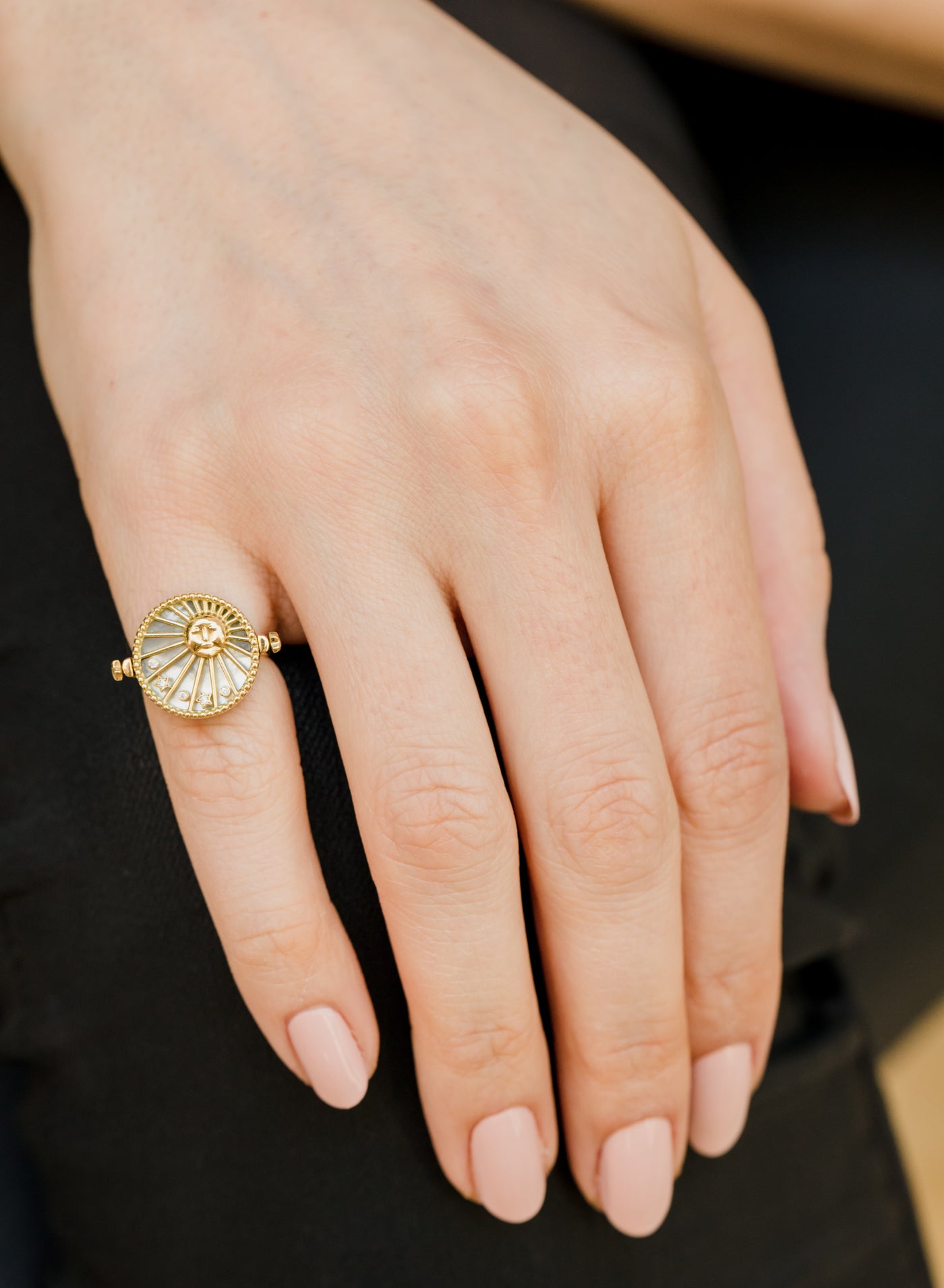 L'Atelier Nawbar 18k yellow gold 3-in-1 Day and Night ring with black onyx, mother of pearl, and white diamonds. Can also be a pendant