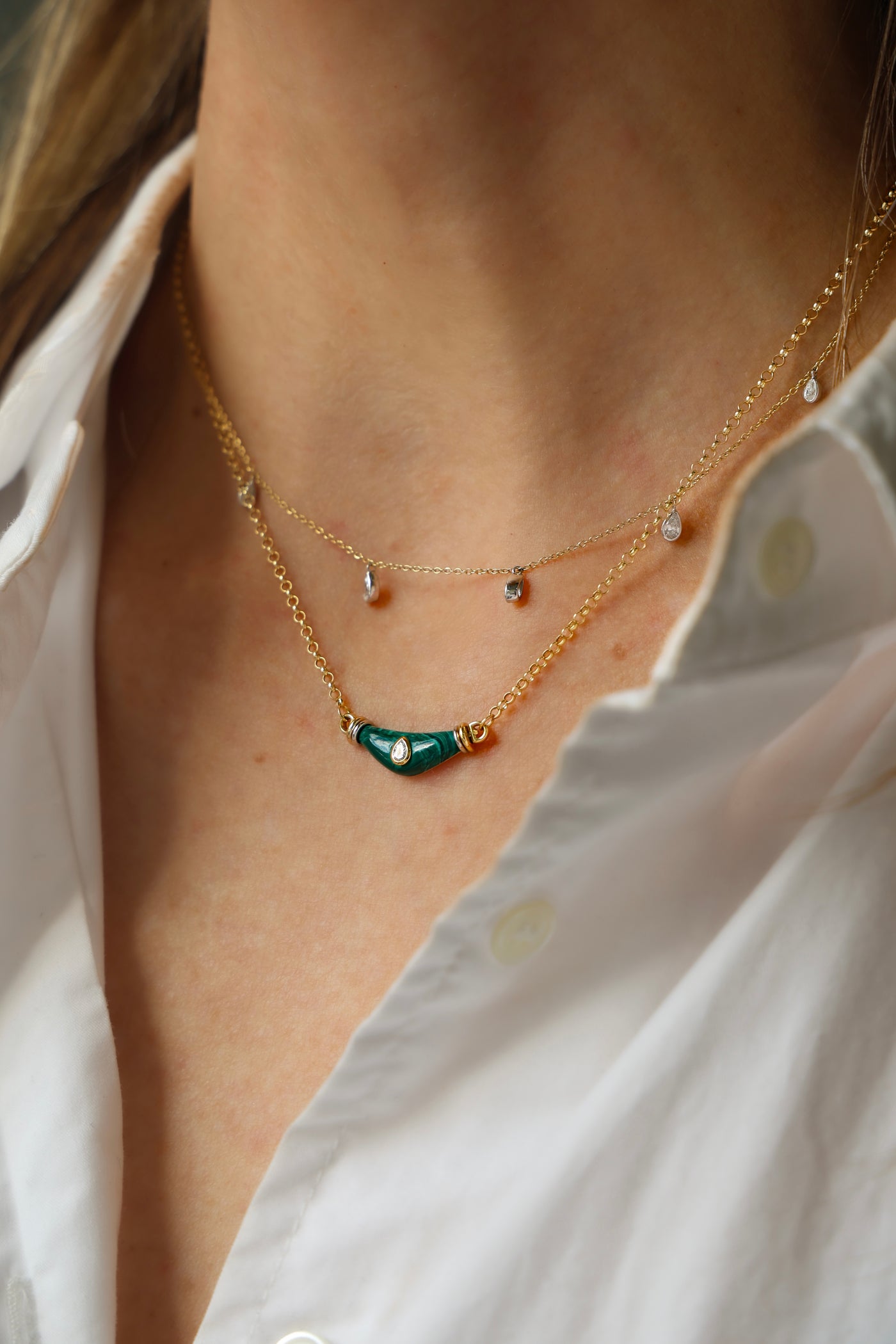 L'Atelier Nawbar diamond drop necklace layered with the malachite and diamond warrior necklace