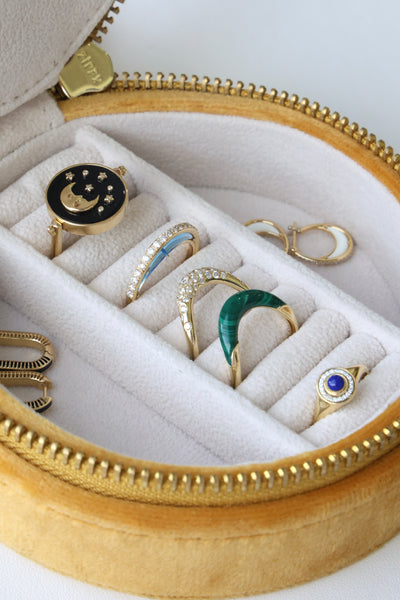 L'Atelier Nawbar velvet embroidered jewelry travel case, shown with rings and earrings inside