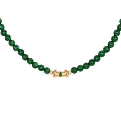 L'Atelier Nawbar special edition Warrior necklace in 18k yellow gold with malachite beads, white diamonds, and a pear shaped emerald.