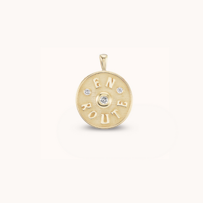 Marlo Laz petite 14k yellow gold charm pendant white diamond. 'En Route' inscription symbolizing the journey, travel, self discovery, and evolving 