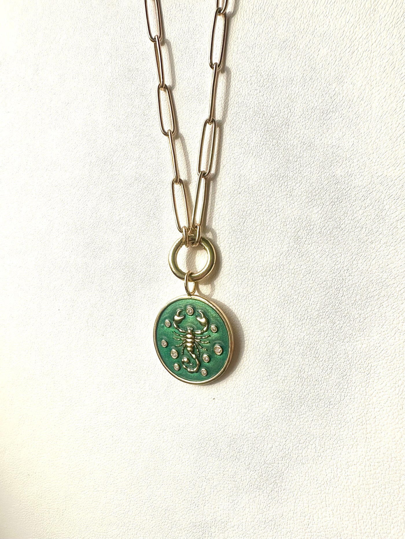 3.8mm elongated link 14k yellow gold paperclip chain with a round hinged clasp for charms, with Kate Collins scorpion charm 