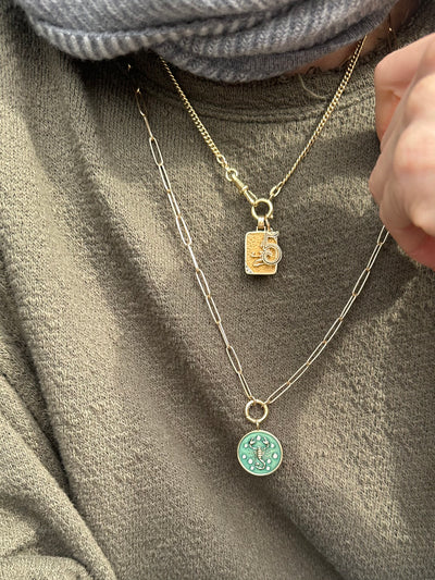 3.8mm elongated link 14k yellow gold paperclip chain with a round hinged clasp for charms, with Kate Collins scorpion charm and Marlo Laz number charm