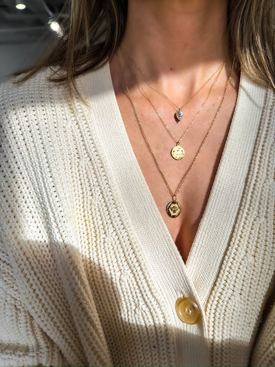 White Space 14k yellow gold necklace with a baroque pearl pendant with a white diamond
