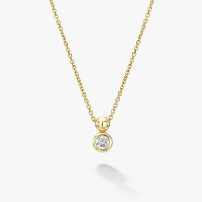 White Space 14k yellow gold white diamond pendant necklace with a unique orb bail that allows the pendent to move with you.