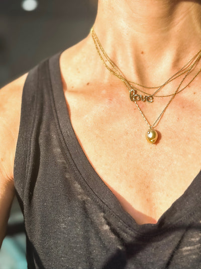 White Space 14k yellow gold Kenna golden South Sea Baroque Pearl pendant necklace with white diamond. 