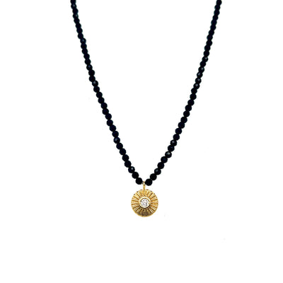 10k yellow gold sun with bezel set diamond on faceted black onyx beads 15 to 16.5" in legnth