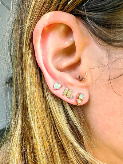 Anzie micro studs with a gold post diamond dainty triangle and round gemstone. Sold as a single or pair