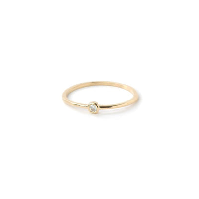 Anzie 14k yellow gold stackable ring with a white diamond encrusted in a round bezel.