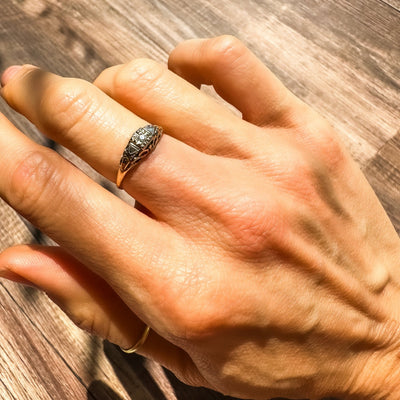 14k yellow and white gold diamond ring circa the 1930's with a tiny white diamond in the center