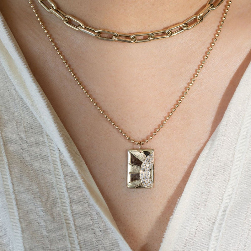 Julez Bryant 14k gold CALS rectangular pendant with full cut round green diamonds and blue sapphires. 