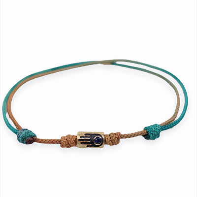 Luis Morais small 14k yellow gold short matte tube with antiqued hamsa relief on a silk cord bracelet