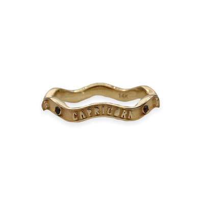 Marlo Laz 14k yellow gold wavy band featuring a Capricorn motif, coordinating symbols, along with garnets. (Can be personalized with different astrological symbols)