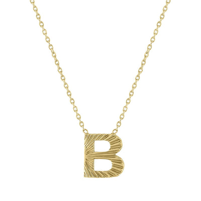My Story 14k yellow gold fluted mini initial pendant attached to an 18" chain with a loop at 16